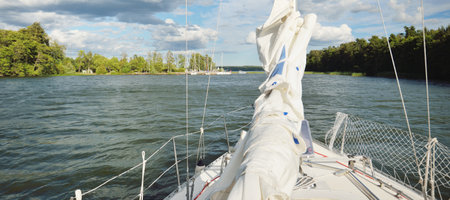 32 feet swedish built cruising sailboat sailing on a clear day. SlandÃ¶kalv, MÃ¤laren lake,...