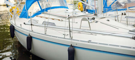 Elegant and modern sailboats moored to a pier in a yacht marina. SlandÃ¶kalv, MÃ¤laren lake,...
