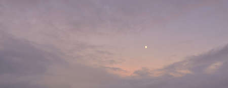 Clear blue sky with glowing pink and golden clouds after the storm. Dramatic sunset cloudscape. Concept art, meteorology, heaven, hope, peace. Graphic resources, picturesque panoramic sceneryの写真素材