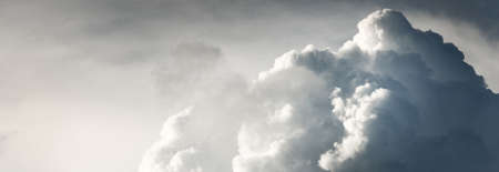 Ornamental clouds. Dramatic sky. Epic storm cloudscape. Soft sunlight. Panoramic image, texture,...
