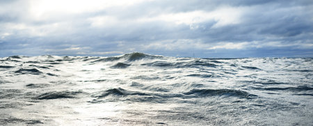 North sea under the dark clouds after the thunderstorm. A view from the sailing boat. Dramatic...