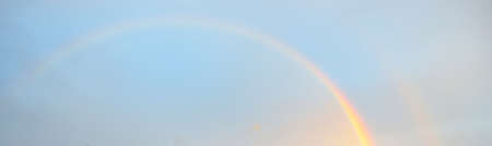 Clear blue sky with glowing pink and golden clouds after the storm. Dramatic sunset cloudscape. Concept art, meteorology, heaven, hope, peace. Graphic resources, picturesque panoramic sceneryの写真素材