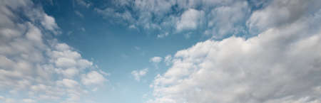 Clear blue sky after the storm. Soft sunlight. Panoramic image, texture, background, graphic resources, design, copy space. Meteorology, heaven, hope, peace conceptの写真素材