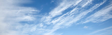 Cloudscape. Clear blue glowing sky. Soft sunlight, cirrus clouds . Panoramic image, texture,...