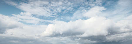 Ornamental clouds. Dramatic sky. Epic storm cloudscape. Soft sunlight. Panoramic image, texture,...