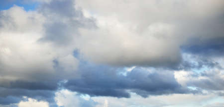 Coudscape. White ornamental clouds. Soft sunlight, sunbeams. Clear blue sky. Natural pattern,...