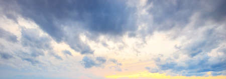 Clear blue sky, red, pink, golden cirrus and cumulus clouds after storm. Dramatic sunset cloudscape....