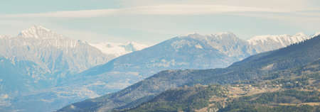 Mountain peaks on a sunny winter day. Clear sky, soft sunlight. French Alps, Ecrins massif, France....