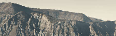Mountain peaks on a sunny winter day. Soft sunlight. French Alps, Ecrins massif, France. Panoramic landscape. Nature, seasons, ski, vacations, wanderlust conceptsの写真素材