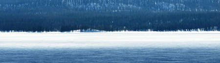 Snow-covered mountains and forest. Idyllic winter landscape. Ecology, environment, climate change, global warming. Finland, Lapland. Panoramic viewの写真素材