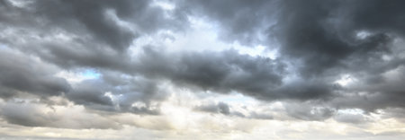 Ornamental clouds. Dramatic sky. Epic storm cloudscape. Soft sunlight. Panoramic image, texture,...
