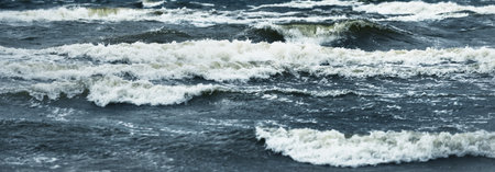 Baltic sea under the dark dramatic clouds after thunderstorm. Latvia. Epic seascape. Cyclone, gale,...