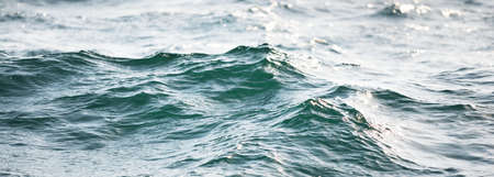 High angle view of the Mediterranean sea. Waves, splashes, water surface texture. Blue, azure,...