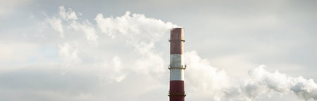 Panoramic view of the large central heating station in dramatic light. Pipe close-up. Ecology, ecological issues, fuel and power generation, environmental damage. Dark industrial cityscapeの写真素材