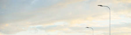 Clear blue sky. glowing pink and golden cirrus and cumulus clouds after storm, soft sunlight....
