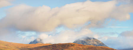 Mountains peaks and valleys. Dramatic sunset clouds. Jura island, Inner Hebrides, Scotland, UK. Atmospheric landscape. Panoramic viewの写真素材