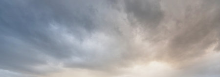 Clear blue sky. glowing pink and golden cirrus and cumulus clouds after storm, soft sunlight. Dramatic sunset cloudscape. Meteorology, heaven, peace, graphic resources, picturesque panoramic sceneryの写真素材