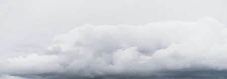 Ornamental clouds. Dramatic sky. Epic storm cloudscape. Soft sunlight. Panoramic image, texture,...