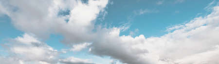Ornamental clouds. Dramatic sky. Epic storm cloudscape. Soft sunlight. Panoramic image, texture,...