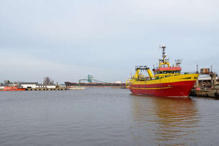 Fishing boat (trawler) anchored in cargo port terminal. Baltic sea, Ventspils, Latvia....