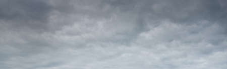Dark ornamental clouds. Dramatic sky. Epic storm cloudscape. Panoramic image, texture, background, graphic resources, design, copy space. Meteorology, weather, thunderstorm. hurricane conceptsの写真素材