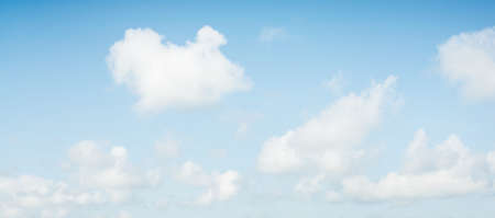Ornamental clouds. Dramatic sky. Epic storm cloudscape. Soft sunlight. Panoramic image, texture, background, graphic resources, design, copy space. Meteorology, heaven, hope, peace conceptの写真素材