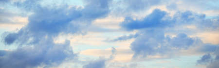 Ornamental clouds. Dramatic sky. Epic storm cloudscape. Soft sunlight. Panoramic image, texture,...