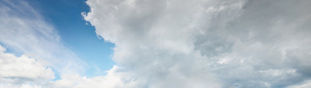 Ornamental clouds. Dramatic sky. Epic storm cloudscape. Soft sunlight. Panoramic image, texture,...