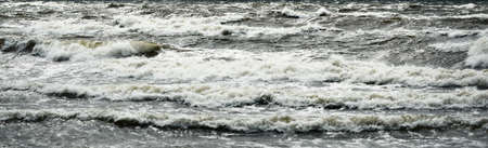 Baltic sea under the dark dramatic clouds after thunderstorm. Latvia. Epic seascape. Cyclone, gale,...
