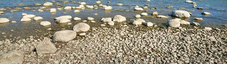 Rocky shore of the Baltic sea. Ancient stones close-up. Spring. Kasmu nature reserve, Estonia....