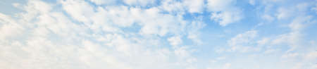 Ornamental clouds. Dramatic sky. Epic storm cloudscape. Soft sunlight. Panoramic image, texture,...