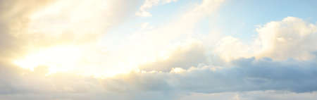 Ornamental clouds. Dramatic sky. Epic storm cloudscape. Soft sunlight. Panoramic image, texture,...