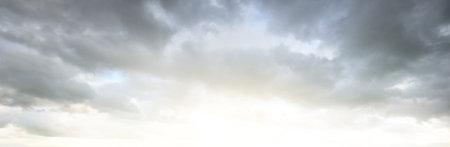 Ornamental clouds. Dramatic sky. Epic storm cloudscape. Soft sunlight. Panoramic image, texture,...