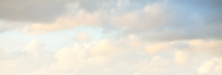 Clear blue sky. glowing pink and golden cirrus and cumulus clouds after storm, soft sunlight....