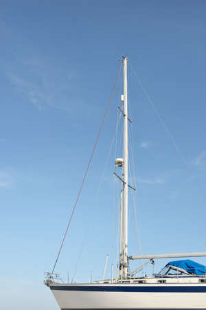 45 ft cruising sailboat standing on land in a yacht marina. Transportation, nautical vessel, repair and service, sailing, sport, recreation. tourism, leisure activity, route, inspiration conceptsの写真素材