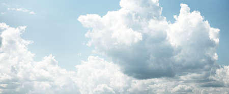 Ornamental clouds. Dramatic sky. Epic storm cloudscape. Soft sunlight. Panoramic image, texture, background, graphic resources, design, copy space. Meteorology, heaven, hope, peace conceptの写真素材