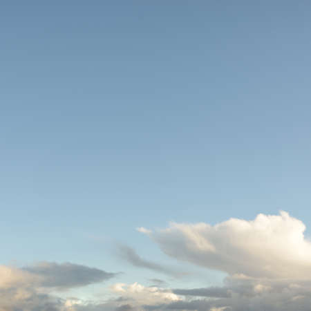Ornamental clouds. Dramatic sky. Epic storm cloudscape. Soft sunlight. Panoramic image, texture,...