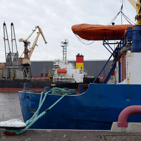 Fishing boat (trawler) anchored in cargo port terminal. Baltic sea, Ventspils, Latvia....