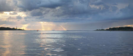 Baltic sea after the storm, panoramic view from a sailing boat. Dramatic sunset sky. Glowing clouds,...