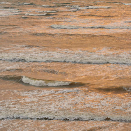 Sea water surface texture. Waves and sphales, storm. Soft sunlight. Panoramic image, graphic resources. Nature, environment conceptsの写真素材