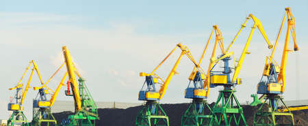 Modern coal terminal in Riga, Latvia. Cranes close-up. Baltic sea. Freight transportation,...