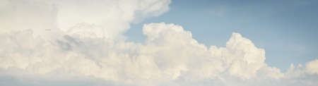 Ornamental clouds. Dramatic sky. Epic storm cloudscape. Soft sunlight. Panoramic image, texture,...