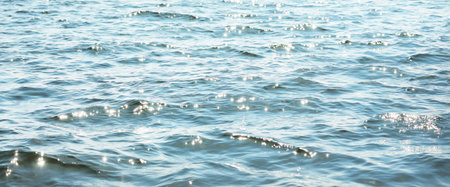 Waves, splashes, glowing water surface texture. Baltic sea. Blue, azure, turquoise colors. Abstract...