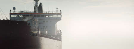 Large red cargo ship (oil chemical tanker, 184  meters length) sailing in the Baltic sea. Freight transportation, logistics, global communications, economy, industry, supply, environmentの写真素材