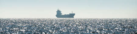 General cargo ship (88 meters length) sailing in the Baltic sea. Freight transportation, logistics, global communications, economy, industry, supply, environmentの写真素材