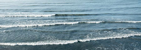 Baltic sea at sunset. Soft sunlight, waves and water splashes. Idyllic seascape. Denmark, Europe....