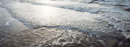 Panoramic view of Baltic sea from sandy shore (sand dunes). Waves, water splashes, foam. Seascape....