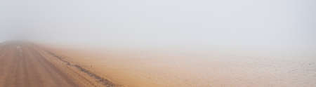 Sandy sea shore in a thick fog after a blizzard. Ice desert. Nature, environment, ecology, climate...