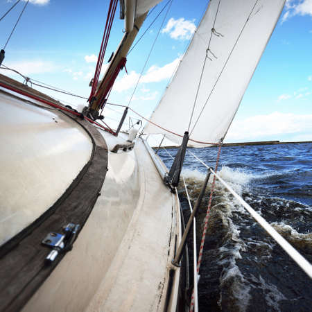 Sloop rigged yacht sailing after the storm. Baltic sea. Lifestyle, cruise, regatta, sport,...