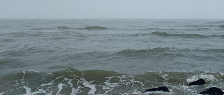 Baltic sea in a fog. Waves, splashing water, storm. Natural textures. Picturesque panoramic...
